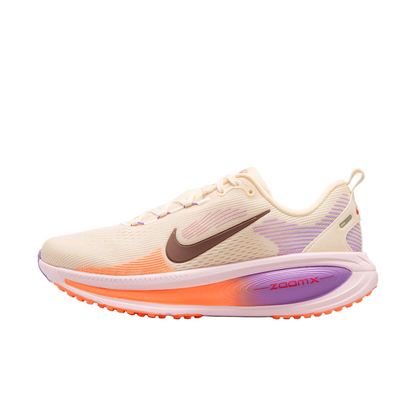 Beige running shoe with purple and orange accents on a white background